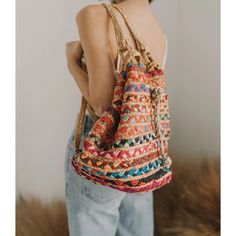 Unique, eco-friendly backpack handcrafted in Rajasthan with vibrant, upcycled Indian textiles and sustainable jute fibers. This versatile bag features two sturdy, braided jute back straps and braided jute drawstring closure cord, providing convenience and style to your day at school, the market, the park, the beach and beyond! Chindi weaving is a traditional and cultural art form which gives function and new purpose to upcycled materials. Made fair trade, by hand in India Bohemian Woven Backpack For Daily Use, Casual Beach Woven Backpack, Casual Woven Backpack For Beach, Casual Beach Backpack With Woven Details, Casual Woven Backpack For The Beach, Casual Natural-colored Backpack For Vacation, Casual Natural Color Backpack For Vacation, Casual Natural Backpack For Vacation, Bohemian Natural Color Backpack