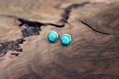 Tiny turquoise stud earrings with hypoallergenic stainless steel posts. There may be slight variations in color due to different calibrations in monitors and each stone being unique. Approximately 7mm in diameter.Matching necklace can be found here:https://www.etsy.com/listing/749967309/turquoise-necklace-dainty-turquoiseStainless steel is my preferred material for many reasons. It is low maintenance and long lasting, resistant to rust and oxidation. It also will not chip as silver and gold plat Turquoise Earrings Studs, Hypoallergenic Turquoise Earrings For Everyday, Cheap Turquoise Minimalist Earrings, Dainty Turquoise Earrings For Gift, Turquoise Stud Earrings Mini, 2023 Wishlist, Silver Engraved Bracelet, Western Fits, Turquoise Stud Earrings