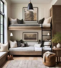 a bedroom with bunk beds and lots of pillows