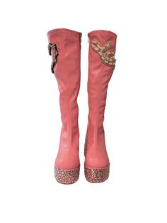 Bedazzled pink knee-high boots by Asta Razma. Custom patch work. Jeweled platform and heel. Inner side zipper closure. Size: 7 Pink Knee-high Platform Boots For Party, Pink High Heel Mid-calf Boots For Party, Pink Platform Heeled Boots For Party, Trendy Pink Boots With Zipper Closure, Pink Leather Knee-high Boots, Pink Leather Knee-high Boots For Party, Pink Knee-high Leather Heeled Boots, Pink Leather Knee-high Heeled Boots, Pink Knee High Boots