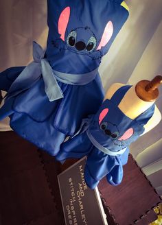 a blue stuffed animal sitting on top of a table