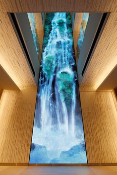 a large waterfall in the middle of a building