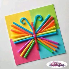 an umbrella made out of colored crayons on top of a piece of paper