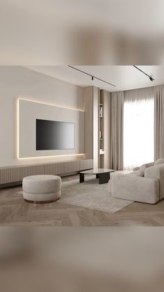 a living room with white furniture and a flat screen tv mounted on the wall above it