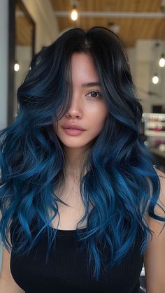 24 Blue Black Hair Ideas That Exude Confidence Black Into Blue Hair, Black To Blue Balayage, Pretty Balayage Hair Brunettes, Blue Bayalage Dark Hair, Black Roots And Blue Hair, Brown And Blue Ombre Hair, Blue Baylage Hair Dark Brown, Dark Roots Blue Hair, Blue Face Framing Highlights