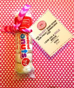 a candy bar wrapped in pink and white polka dots