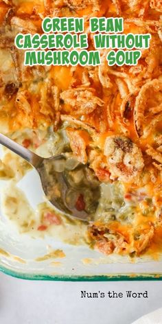 green bean casserole without mushroom soup in a glass dish with a serving spoon