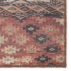 an old rug with many different colors and patterns