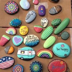 colorful rocks are arranged on a brown paper bag