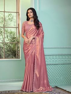 Introduce an air of enchanting elegance to your wardrobe with the "Moonlit Grace" Pink Pattern Georgette Silk Saree, now available for rent. This exquisite saree is the epitome of luxury and sophistication, perfect for making a memorable impression at any special occasion. Crafted from premium georgette silk, this saree features an intricate pink pattern that reflects the delicate beauty of moonlight, ensuring you shine with every step. The soft pink hue combined with the elegant pattern exudes femininity and charm, making it ideal for weddings, festive celebrations, or formal gatherings. The lightweight and flowing georgette silk fabric ensures a graceful drape, offering both exceptional comfort and chic style, allowing you to move effortlessly and confidently. The "Moonlit Grace" saree i Wedding Mehendi, Gudi Padwa, Readymade Saree, Wedding Saree Indian, Silk Saree With Blouse, Pink Pattern, Georgette Fabric