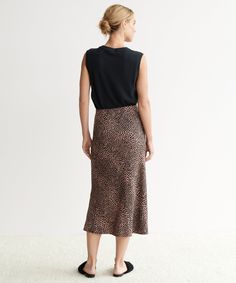 Cheetah Slip Skirt Clay Cheetah simple silhouette and elevated neutral print make this skirt the perfect piece for dressier evenings or playful days on-the-go. Pair it with a classic crewneck knit or a basic tee for an easy approach to everyday style. 100% viscose. Made in China of Italian viscose. Mid-calf skirt with elastic waistband. Chic Leopard Print Skirt For Spring, Chic Leopard Print Midi Skirt, Chic Flowy Leopard Print Skirt, Fitted Elegant Leopard Print Skirt, Elegant Fitted Leopard Print Skirt, Chic Lined Leopard Print Skirt, Chic Leopard Print Lined Skirt, Chic Leopard Print Skirt For Day Out, Chic Leopard Print Skirt