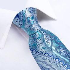 Treat yourself with a new pattern and splash of color to your look with this unique tie set. 100% Silk Handmade Package Includes: Tie, Pocket Square & Cufflinks. Length: 59" Width: 3.34" Warm iron if needed Blue Elegant Tie For Father's Day, Elegant Blue Tie For Father's Day, Adjustable Blue Ties For Formal Occasions, Adjustable Blue Ties For Father's Day, Blue Adjustable Suit And Tie Accessories For Formal Occasions, Formal Blue Adjustable Suit And Tie Accessories, Uniform School, Prom Gift, Unique Ties