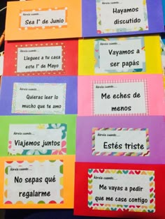 several colorful spanish cards with words on them