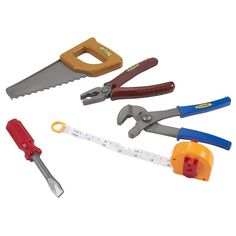 four different tools are arranged in the shape of a saw, pliers, and scissors