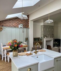 a kitchen with two sinks and an oven