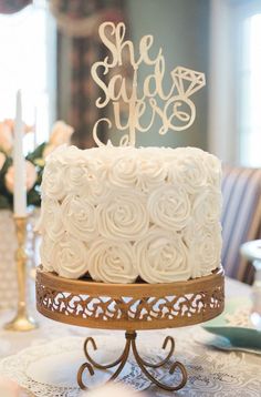 a white cake sitting on top of a table