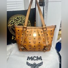 Gorgeous Preloved Mcm Luxury Handbag! Codey5722 Good Exterior Condition. Good Interior Condition. Only One Spot Damaged And Looks Like Someone Tried Repairing It On Corner Bottom. Can’t Hardly See It. I Did Zoom In On Bag So You Can See It And Next Picture After Is What It Looks Like From Distance. Not Very Visible At All. Zipper Works Great. No Repairs To It. The Bag Has Been Conditioned And Protectant Added By Myself, Gold Is Slightly Tarnish But Has Been Cleaned And Shined As Best To Ability. Very Nice. Purse Is In Great Shape. Beautiful. The Only Other Damage I See Is The Long Shoulder Strap. (Which Is Removable So You Don’t Even Have To Use And Can Buy Mcm Handbags, Like Someone, Liking Someone, Luxury Handbags, See It, Shoulder Strap, Bag Lady, Purse, Womens Sizes