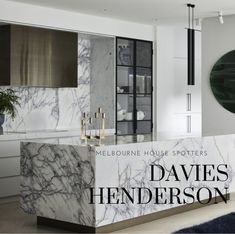 a kitchen with marble counter tops and cabinets in the background is an advertisement for melbourne house spotters