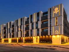 an apartment building lit up at night