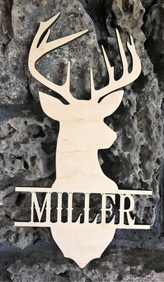 a wooden sign that says muler with a deer's head in the middle