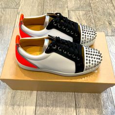 Brand New! White Sneaker With Olive Green Tongue, Black Patent Leather Trim, Neon Orange Heels, And Of Course, Red Soles. Comes With Box, Dust Bag, Extra Laces And Spikes. Size Eu 40 Luxury White Sneakers With Spikes, Luxury White Custom Sneakers With Red Sole, Luxury White Spiked Sneakers, Christian Louboutin Sneakers, Orange Heels, Leopard Shoes, Red Louboutin, Christian Louboutin Men, Navy Blue Fabric