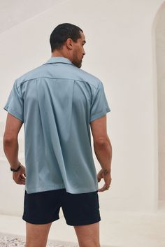 If you're a guy that likes details and neutral tones, then the Vaughn Blue Satin Camp Shirt is perfect for you! Wear it to a festival, on tropical vacation with the boys, or for your casual everyday look. PRODUCT DESCRIPTION AND MATERIALS: - blue satin short sleeve men's top - button up front closure - finished hem - 95% polyester, 5% spandex - dry clean SIZE RECOMMENDATIONS: - runs true to size Small - length: 29" - chest: 22" across - sleeve length: 6.5" Medium - length: 29.5" - chest: 23.25" Satin Short Sleeve, Satin Short, Camp Shirt, Tropical Vacation, Blue Satin, Camping Shirt, Casual Everyday, The Boys, Neutral Tones