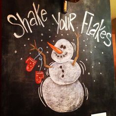 a chalk drawing of a snowman with red mittens