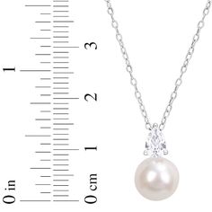 This exceptional necklace displays a lustrous freshwater cultured pearl topped by a sparkling pear-shaped white lab-created sapphire. Styled in sterling silver, the pendant sways from an 18-inch cable chain that secures with a spring ring clasp. Pear-shaped Pearl Pendant Jewelry With Cubic Zirconia, Formal Pear-shaped Pearl Drop Necklace, Formal Pear-shaped Pearl Necklace, Classic Cubic Zirconia Pear Necklace, Fine Jewelry Pearl Necklace In Pear Shape For Anniversary, Classic Pear-shaped Cubic Zirconia Necklace, Pear-shaped Pearl Pendant Necklace, White Gold Pear-shaped Pearl Drop Necklace, Pear-shaped Pearl Necklace Gift