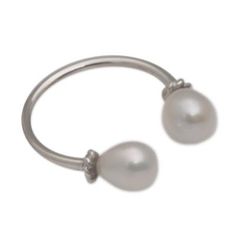 This unusual wrap ring is the design of Bali's Made Sri. A simple sterling silver band culminates in pear-shaped cultured pearls at each end. Discreet rope motifs support both pearls. Adjustable Modern Pearl Ring, Modern Adjustable Pearl Ring, Modern Adjustable Pearl Ring For Anniversary, Adjustable Pear-shaped Silver Jewelry, Pearl Jewelery, Expensive Rings, Silver Wrap Ring, Wrap Ring, Freshwater Cultured Pearls