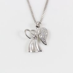 "LarkKing LK13018 Sterling silver angel necklace, angel wing necklace, angel heart charm, silver angel pendant, angel necklace for women, angel for gift, Christian gift. Pendant material: White gold plating sterling silver with cubic zirconia crystal, solid 925 sterling silver Pendant size: 9/16\" x 3/4\" (width x height); pendant weight: 1.35 g Necklace Chain: High quality unique solid 925 sterling silver chain with white gold plating, see the above image. To select Sterling Silver Chain Style Silver Angelic Jewelry For Gift, Angelic Silver Jewelry For Gift, Silver Angel Wings Necklace As Gift, Angel Wings Jewelry For Anniversary, Wing-shaped Sterling Silver Necklace, Elegant Heart-shaped Angel Wings Necklace, Elegant Heart Shaped Angel Wings Necklace, Silver Angel Wings Pendant Necklace, Elegant Silver Necklace With Angel Wings