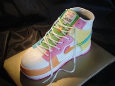 a pair of colorful sneakers sitting on top of a table