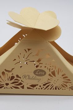 a wedding card box with a paper cut out of it's top and the lid open