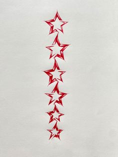 a drawing of red stars on white paper