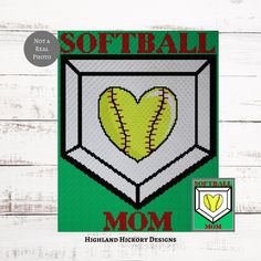 a softball mom's heart is in the middle of this cross stitch pattern on a white wooden background