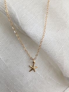 "♡ 14K gold-filled 18\" chain with 4/8\" hallow starfish charm- all components used on this necklace is 14k gold filled, sourced from USA. ♡ If your purchase is a gift, let me know and I'd be happy to include a lovely gift card for no additional charge. All items are packaged in jewelry boxes. ♡ Most of my jewelry can be ordered in multiples. Please contact me if you are interested in purchasing two or more of one item and I can set up a special listing for you. ♡ All orders ship to the address Gold Starfish Charm Necklace, Dainty Gold Starfish Charm Necklace, Gold Charm Necklace With Starfish Charm, Dainty Starfish Charm Jewelry For Gift, Gold Jewelry With Starfish Charm For Gift, Gold Jewelry With Starfish Charm As A Gift, Dainty Starfish Charm Jewelry Gift, Starfish Charm Necklaces As Gift, Starfish Charm Necklaces For Gifts