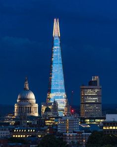 the shardling building is lit up at night