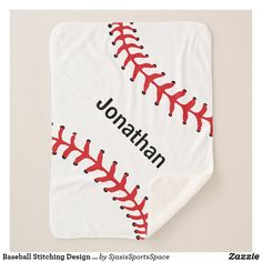 a baseball themed blanket with red stitching on the bottom and black stitches across the top