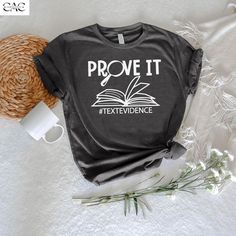 Prove it Text Evidence Shirt, ELA Teacher Shirt, English Teacher shirt ,Teacher Shirt ,Reading Teacher Shirt, Research Shirt,Prove It Shirt 👉How Do I Order👈 1️⃣ Please review all the information provided before placing an order 2️⃣ Select the shirt size using the drop down menu. 3️⃣ Select the color of the shirt using the following drop down menu. * * Different styles of shirts may have different shades of same color choice due to different manufacturer brands. * * For this reason, we recommend you to match shirts from the same styles if you want precisely matching colors (ex. Unisex, V-necks, Toddler, etc.). 4️⃣ Need more Items? Add the current item in the cart. And If you like to add more items to your order please press the back button and repeat steps 1-3 again. 5️⃣ Once all your des Reading Teacher Gifts, English Teacher Shirt, Funny English, English Teacher Gifts, Text Evidence, Ela Teacher, It Shirt, Reading Teacher, English Teacher