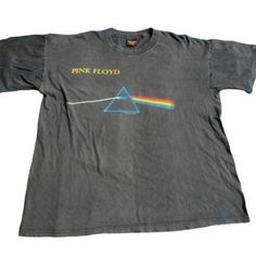 a dark side of the moon t - shirt with pink floyd's logo on it