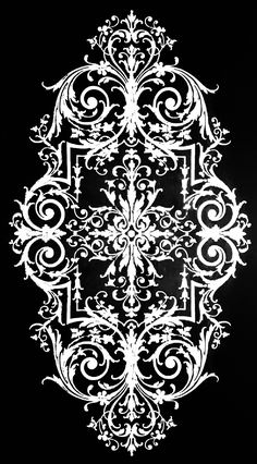 a black and white photo of an intricate design