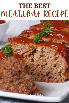 meatloaf with sauce and garnish on a white plate