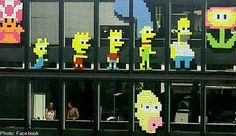 the simpsons characters are all made out of legos in front of an office building