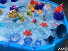 a child's bathtub filled with toys and water