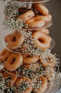 a stack of donuts with baby's breath sprinkles