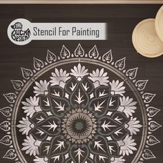 the stencil for painting is being used to create an intricate design on wood paneling