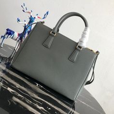 Size: 32cm*24cm*14cm It comes with Dust box, Care manual, Tag, and Paper bag. Designer Gray Rectangular Shoulder Bag, Luxury Gray Rectangular Satchel, High-end Rectangular Satchel For Office, Designer Gray Satchel Bag, High-end Office Satchel In Rectangular Shape, Classic Gray Rectangular Bag, Classic Gray Rectangular Bags, Gray Rectangular Office Bag, Gray Rectangular Satchel