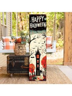 a halloween door hanger with an image of a house on it