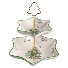 two tiered serving trays with christmas trees on the bottom and gold trimming