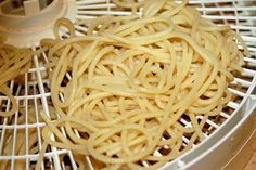 some noodles are being made in a machine