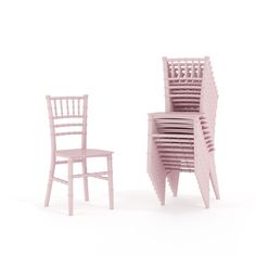 two chairs and a table made out of wooden slats, one in light pink